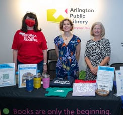 Women standing at the FOAL promo table